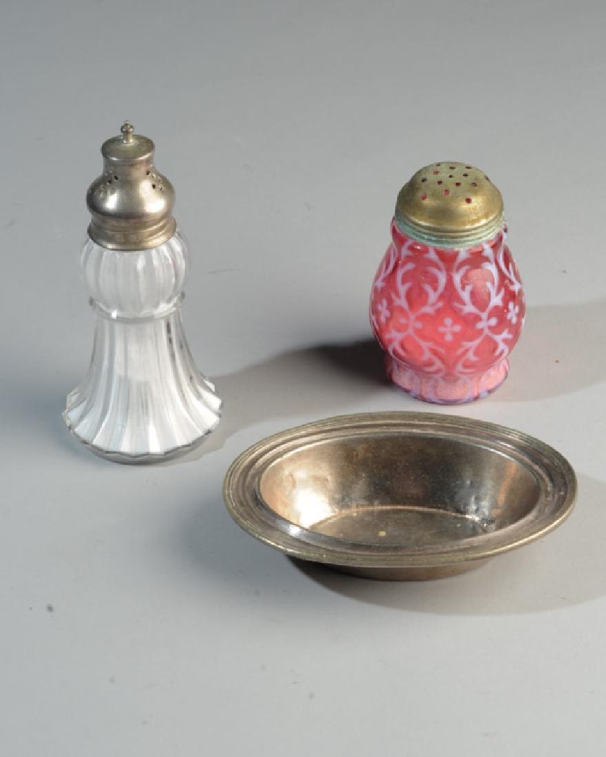 Antique Glass Sugar Castors, Gorham Hotel Silver: Cranberry glass mufineer with opalescent overlay in the "Spanish Lace" pattern, screw top lid, unmarked but probably Northwood. The other tassel shaped clear fluted glass with shaped lid, flower mark