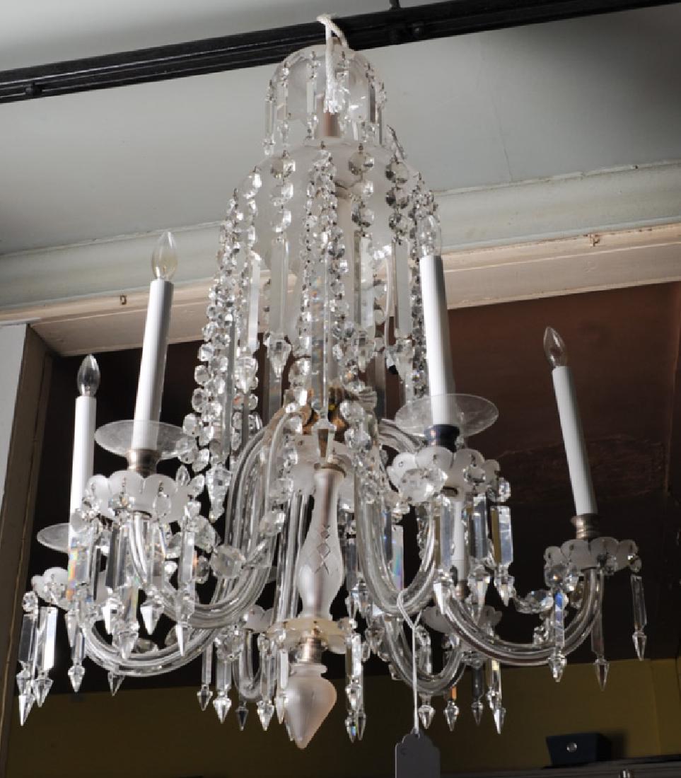 Long Vintage or Antique 6 Light Crystal Chandelier: With glass-encased arms, frosted cut glass encased center column, long faceted crystal chains, long pointed hanging crystals, scalloped bobeche, long electric tapers, inverted tear-drop bottom ball. L