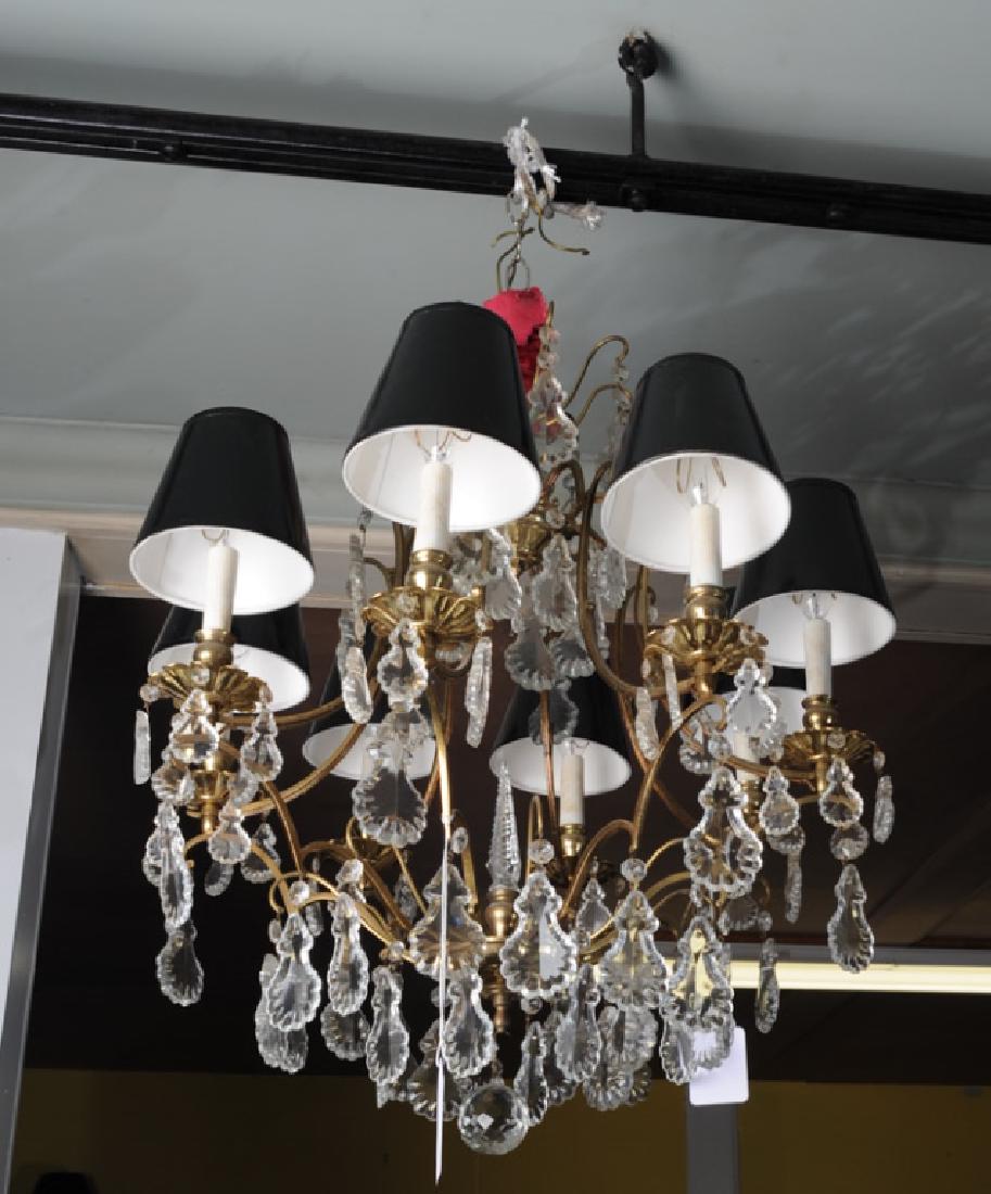 French Style 8 Light Crystal Spear Chandelier: With gilt bronze cage, multiple hanging pear shaped crystals, faceted central crystal spear and faceted hanging center ball. Black shades probably not original. Possibly French. Approx. 33" in length.