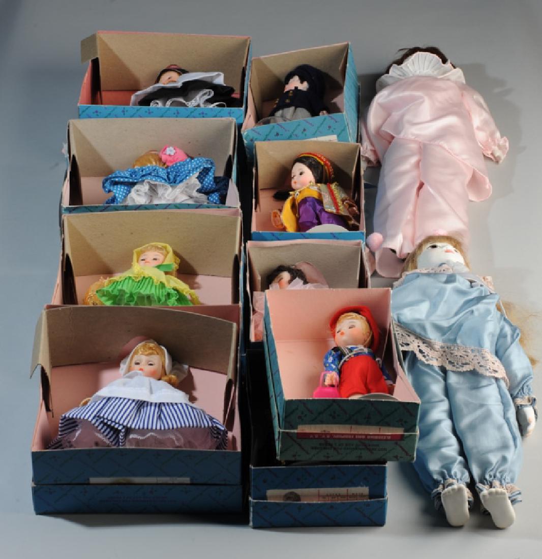 Nine Madame Alexander Dolls in Original Boxes: Including Switzerland 540, Miss Muffet 452, Daffy Down Dilly 429, Little Maid 423, Laurie Little Men 416, Turkey 587, Ballerina 430, Indonesia 579, and Hansel 453. Together with two porcelain head dol