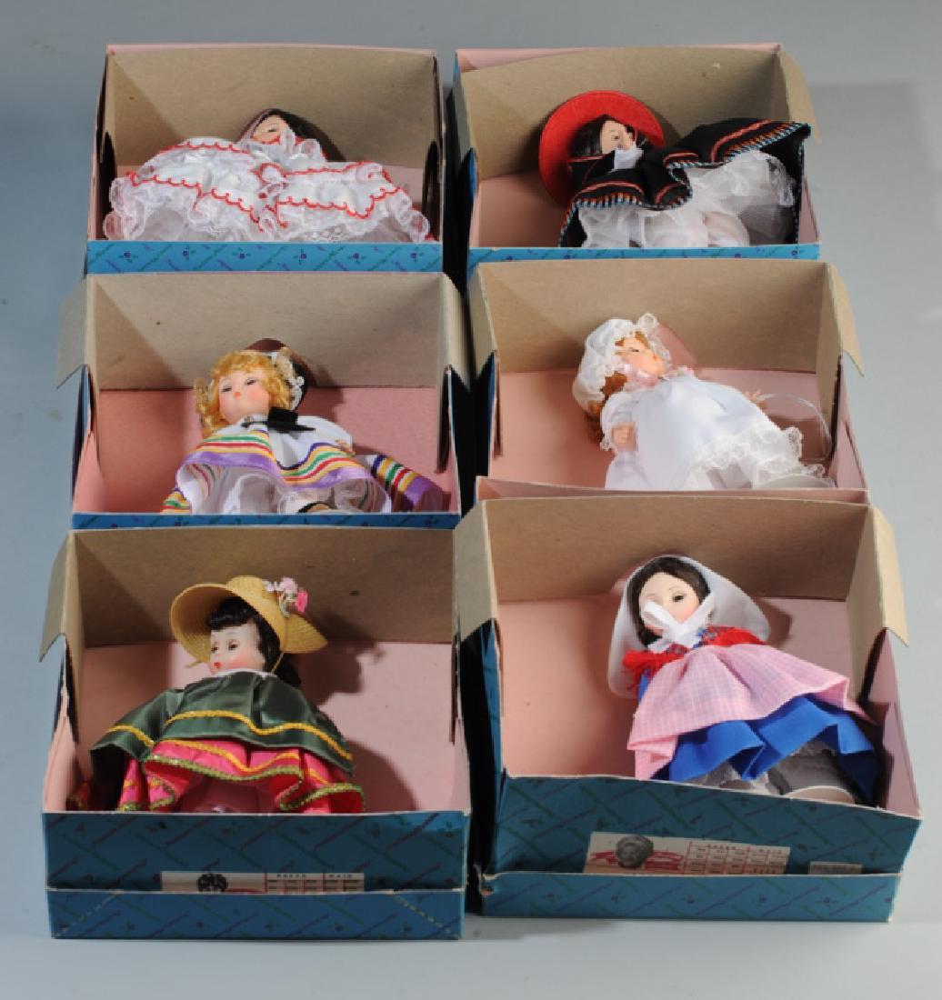 Six Madame Alexander Dolls in Original Boxes: Including Estonia 545, Italy 593, Belgium 562, Panama 555, Little Nanny Etticoat 428, and Peru 556. Size of Box: approx. 8 1/4" x 8 1/2" x 3 1/2".