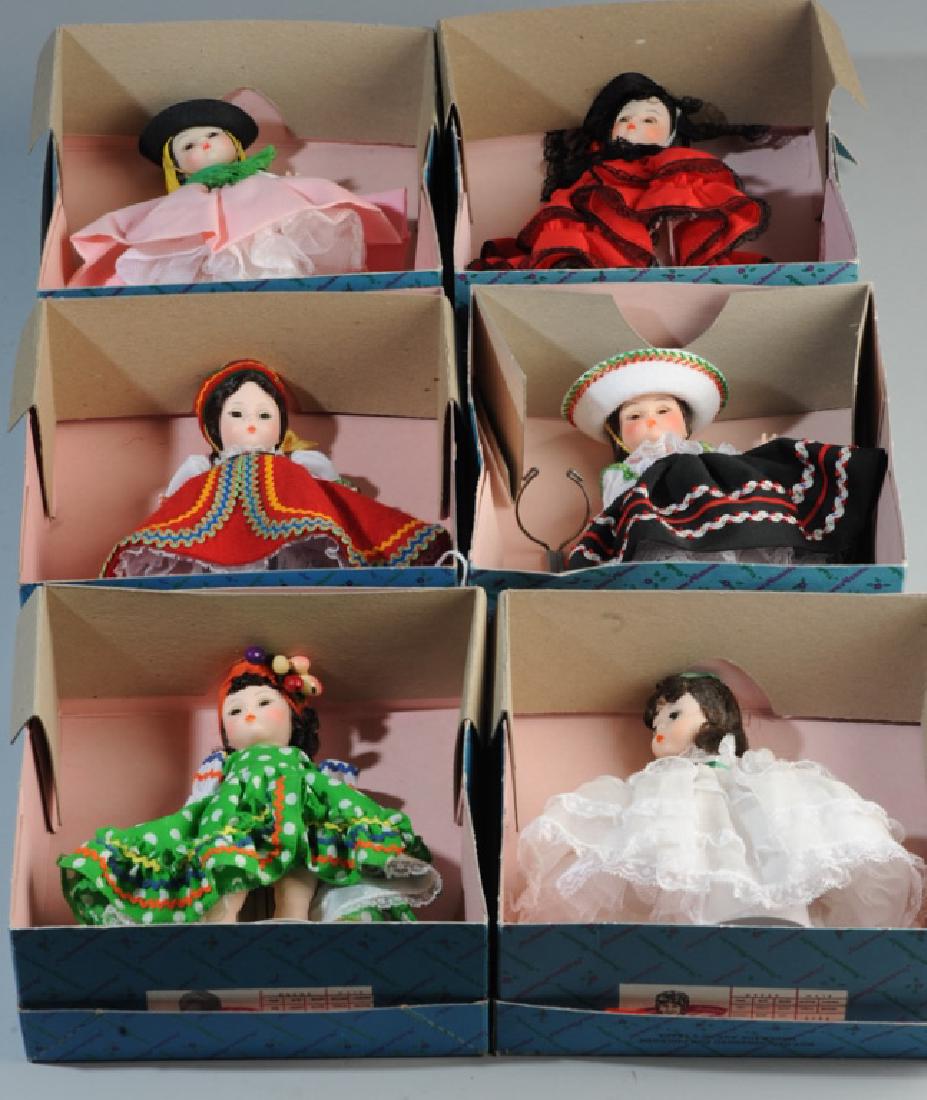 Six Madame Alexander Dolls in Original Boxes: Including Mexico 576, Portugal 585, Brazil 573, Spain 595, Czechoslovakia 564, and Scarlett 425. Size of Box: approx. 8 1/4" x 8 1/2" x 3 1/2".