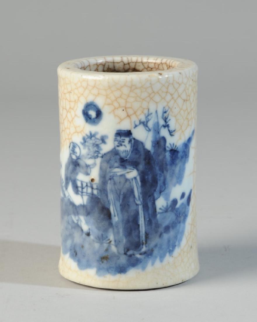 Qing Chinese Blue & White Crackle Brush Pot: 19th C. Chinese brush pot with underglaze blue on white decoration of a boy bringing flowers to a sage in a garden setting, with crackle glaze inside and out. Approx. 4 1/4" in height, 2 3/4" diameter