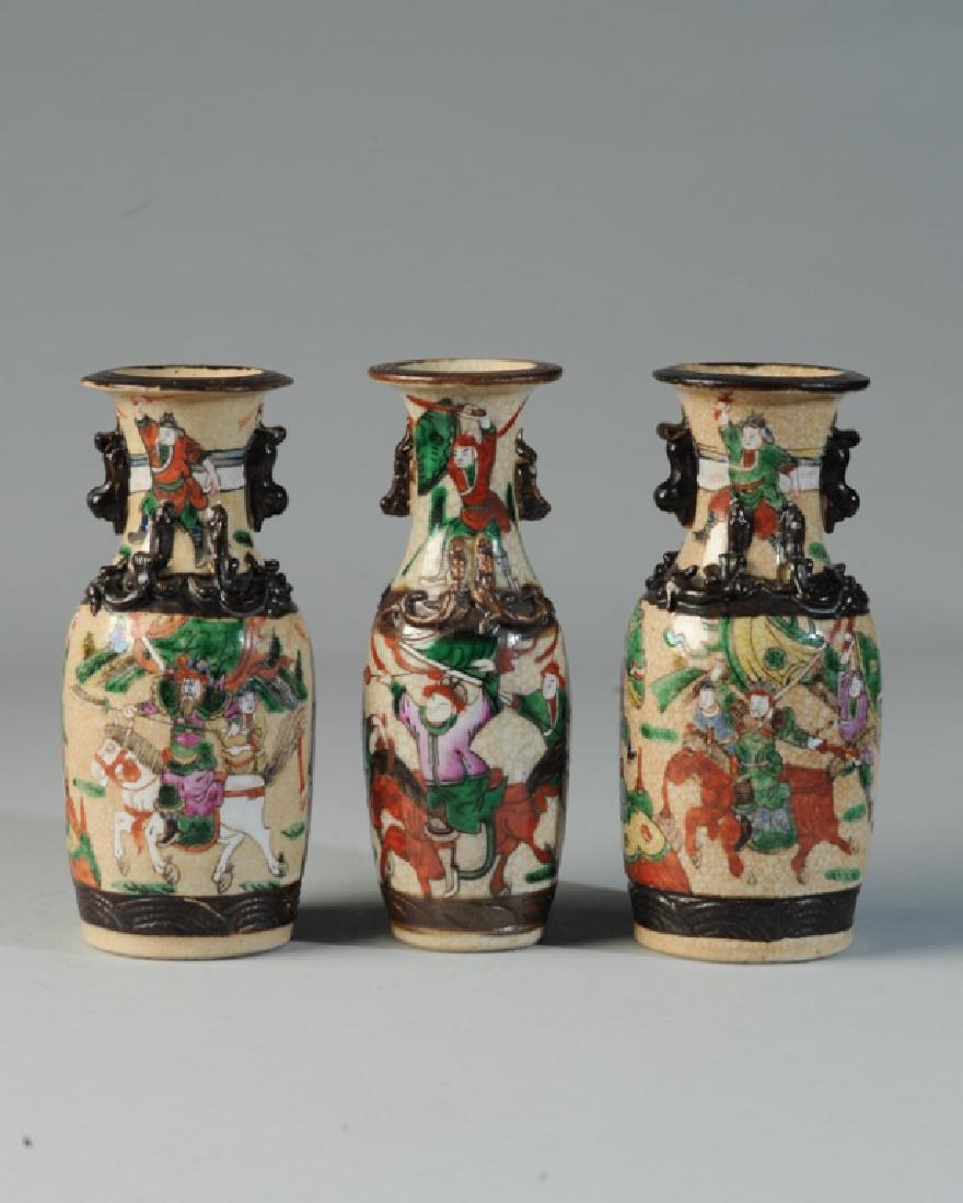 3 Chinese Crackle Glaze Famille Verte Dragon Vases: With scenes of battle on horseback in green, red, purple, white, yellow, and black enamels, with applied brown rims, dragons, handles, and borders. Etched brown marks to base. Probably late Qing - ear