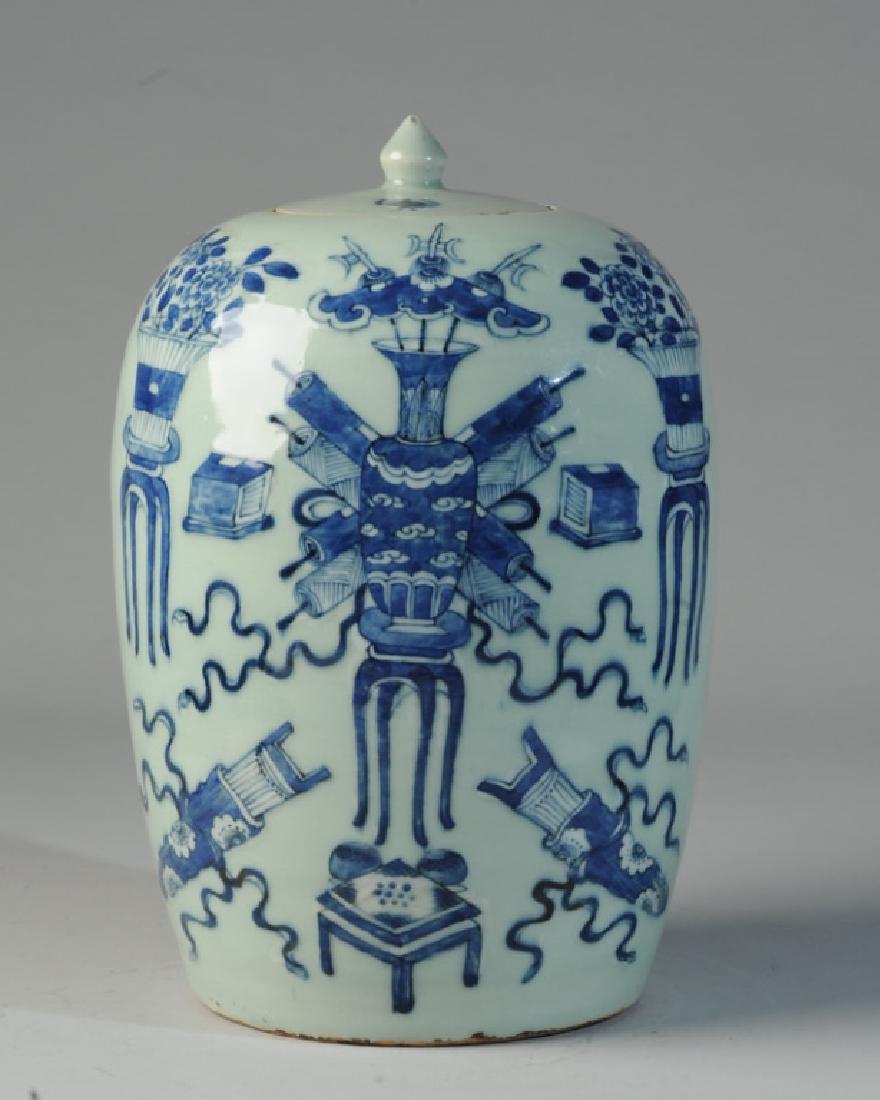 Chinese Blue & White Celadon Jar and Cover: With 'Hundred Antiques' motif, showing vases, scrolls, flowers, and other auspicious objects. Good condition, no cracks, just a few small chips to lid. Approx. 12" in height.