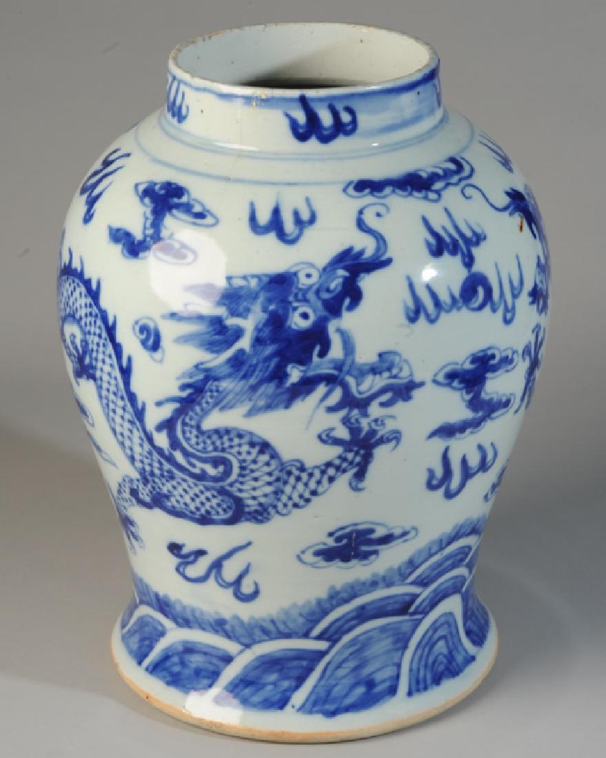 Large Chinese Blue & White Dragon Vase: Heavy meiping vase with two five-toed dragons chasing a flaming pearl amidst clouds over rolling waves. Approx. 14" in height. No marks to base. A few small chips to rim, no cracks or repairs.