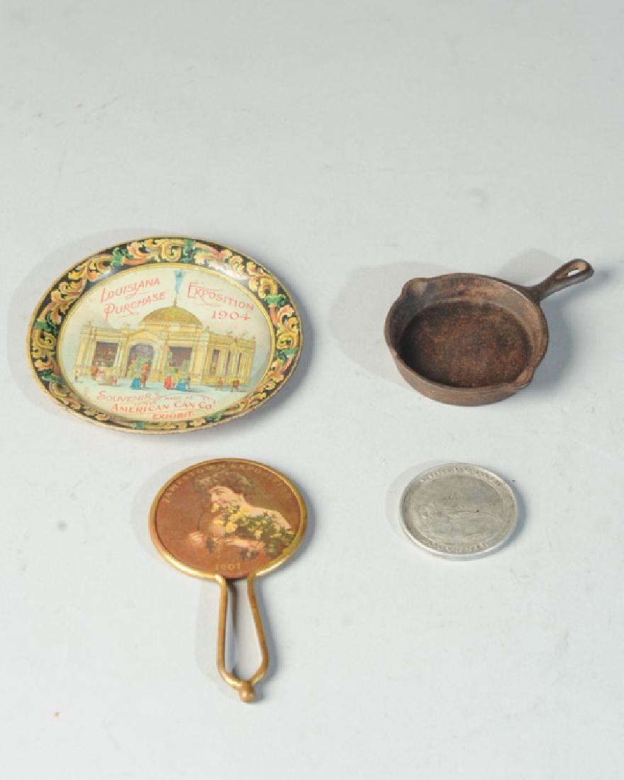 World's Fair Lot: Louisiana Purchase 1904 Expo Tip Tray, St. Louis 1904 Home Comfort Ranges frying pan, Jamestown 1907 Expo mirror, Columbian Expo token.