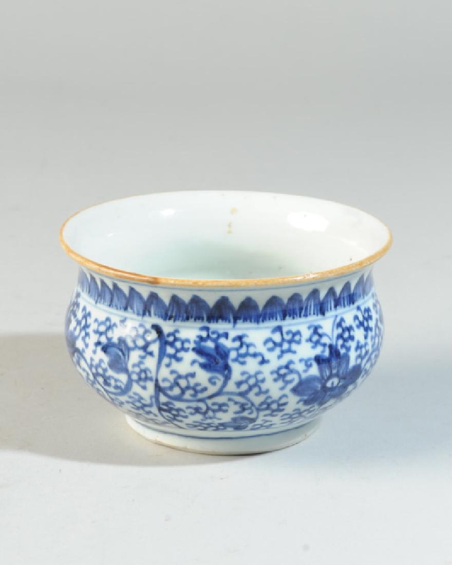 Chinese Blue and White Porcelain Censer: Small censer or cache pot with flaring rim, with scrolling lotus in underglaze blue to body, and with lappet border at neck. Brown dressing to rim. Kangxi double circle in underglaze blue to base. Sma