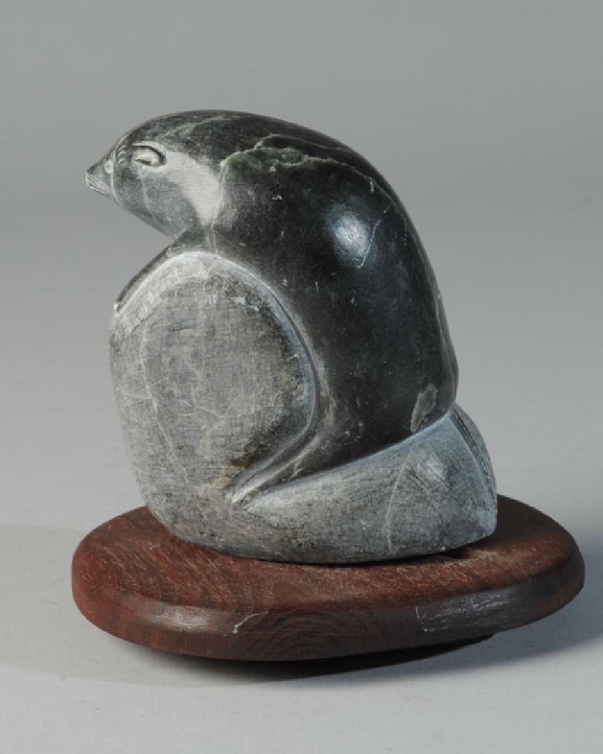 Inuit Stone Carving: Sea lion and fish, signed to base, in fitted stand. H: approx. 4 1/2".