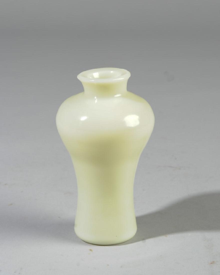 Chinese Peking Glass Meiping Cabinet Vase: Small Peking glass vase in the color of mutton fat jade. Approx. 4 1/4" in height. No chips or cracks.