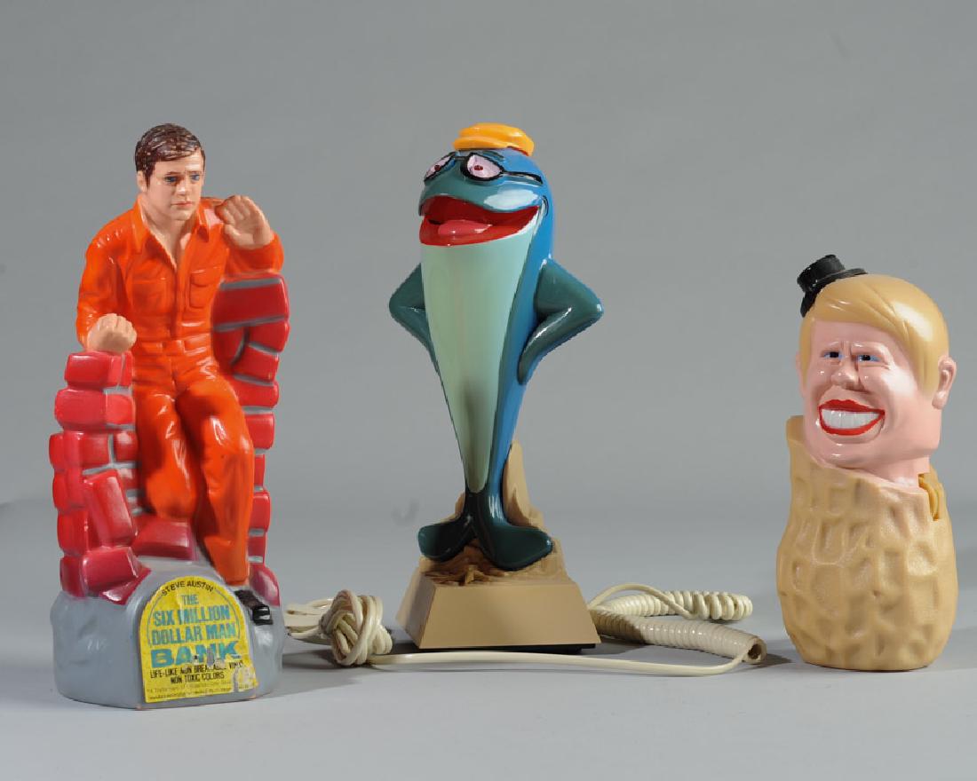 Mixed Lot: Jimmy Carter radio, Six Million Dollar Man bank, Star-Kist Tuna telephone. Tallest: approx. 10".