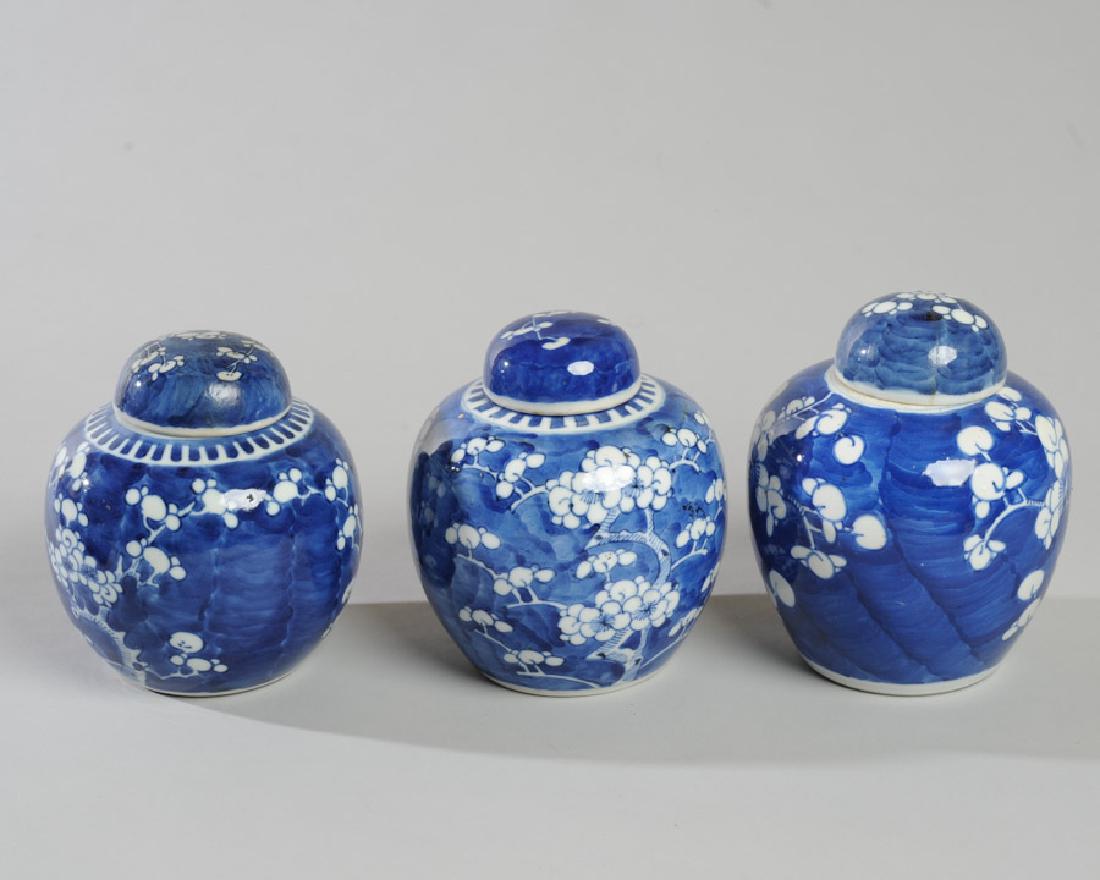 3 Chinese Blue & White Prunus Ginger Jars & Covers: All with double circle mark in underglaze blue to base, one with additional red stamped "China" mark. All covers present; two have been professionally repaired. Tallest, approx. 6 1/2" in height. From