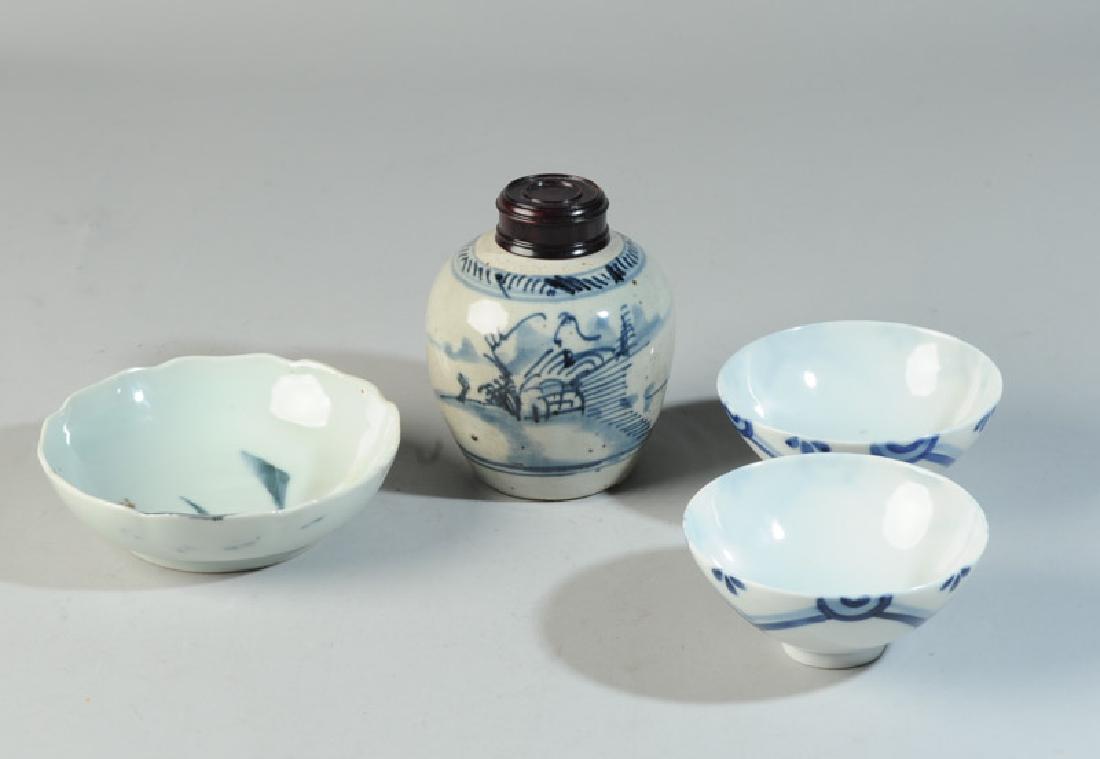 Chinese & Japanese Blue & White Porcelain Lot: Pair of Japanese bowls with simple decoration in underglaze blue, together with a small Chinese or Japanese porcelain bowl with undulating rim and a scene of a pagoda overlooking a mountain lake rende