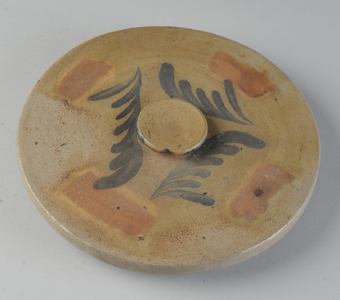 Strasburg, Virginia Decorated Stoneware Lid: Cobalt blue and rust decorations, 19th century. Dia: approx. 9 1/2".