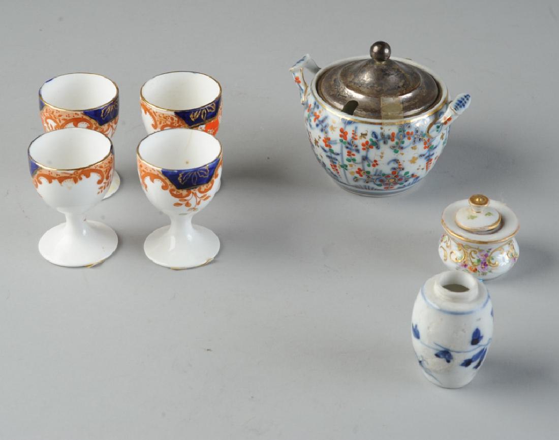 Mixed Mini Porcelain Lot: Bristol, Dresden, etc: To include an 18th C. Bristol sugar bowl, (with T mark to base in underglaze blue, and with a make-do later Gorham sterling silver lid,) a 19th C. Dresden pin box, 4 19th to early 20th C. egg cups by