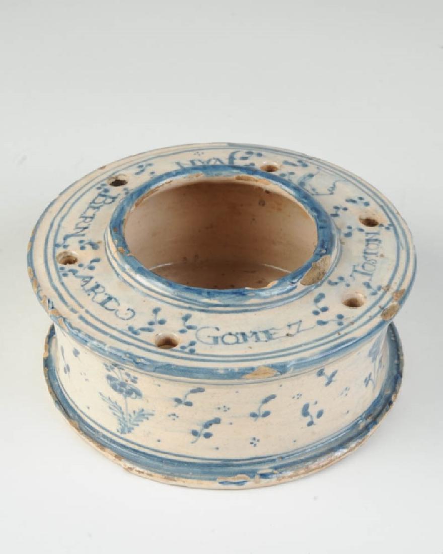 18th C. Talavera Inkwell: Probably 18th C. or earlier. Blue and white glazed pottery inkwell with six quill holes and large center well. The name "Juan Bernardo Gomez", with "Toston", a surname or place name, appears around th