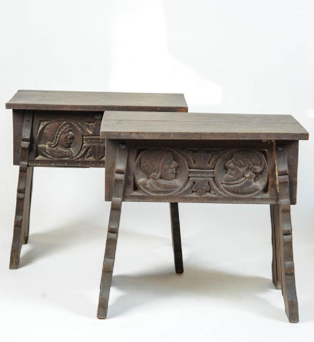 Pair Tudor Style Carved Joint Stools/ Tables: With carved portrait medallions on each side, and armorial carving on each end. One stool has top that opens to storage space inside. The other has fall front opening to storage box. (On this one the