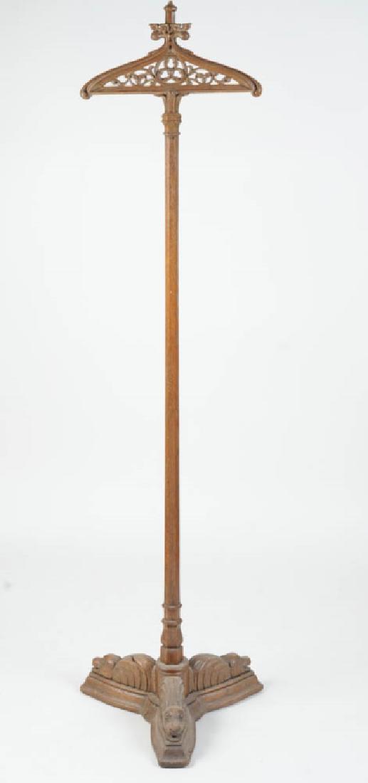 Gothic Oak Vestment Stand or Valet: Foliate openwork carving at hanger, tripod base carved with three fantastical beasts. 19th C. or earlier. Approx. 69 3/4" in height. Provenance: The collection of Ambassador and Mrs. Alexander Weddell