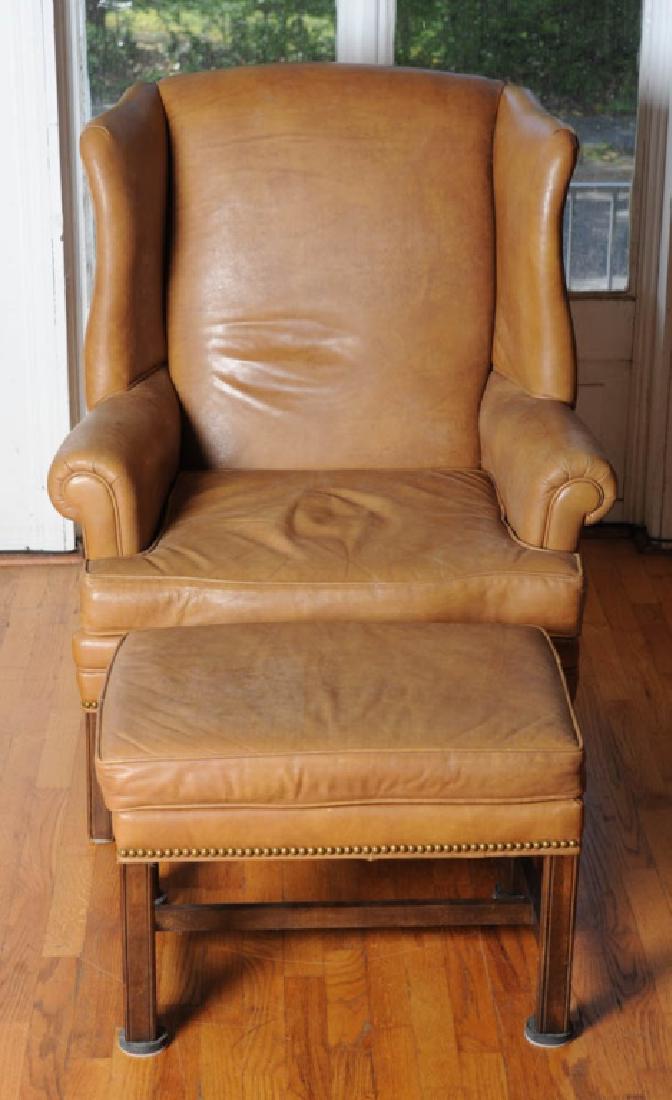 Leather Upholstered Wingback Armchair & Ottoman: Wingback armchair and ottoman with leather upholstery, brass tack accents on square legs. Chair H: approx. 41".