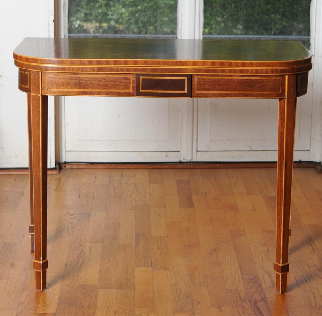 Hepplewhite Style Inlaid Card Table: String inlay to folding top, apron and leg, square tapered legs, 20th century. H: approx. 28 3/4". W: approx. 36". D: approx. 18".