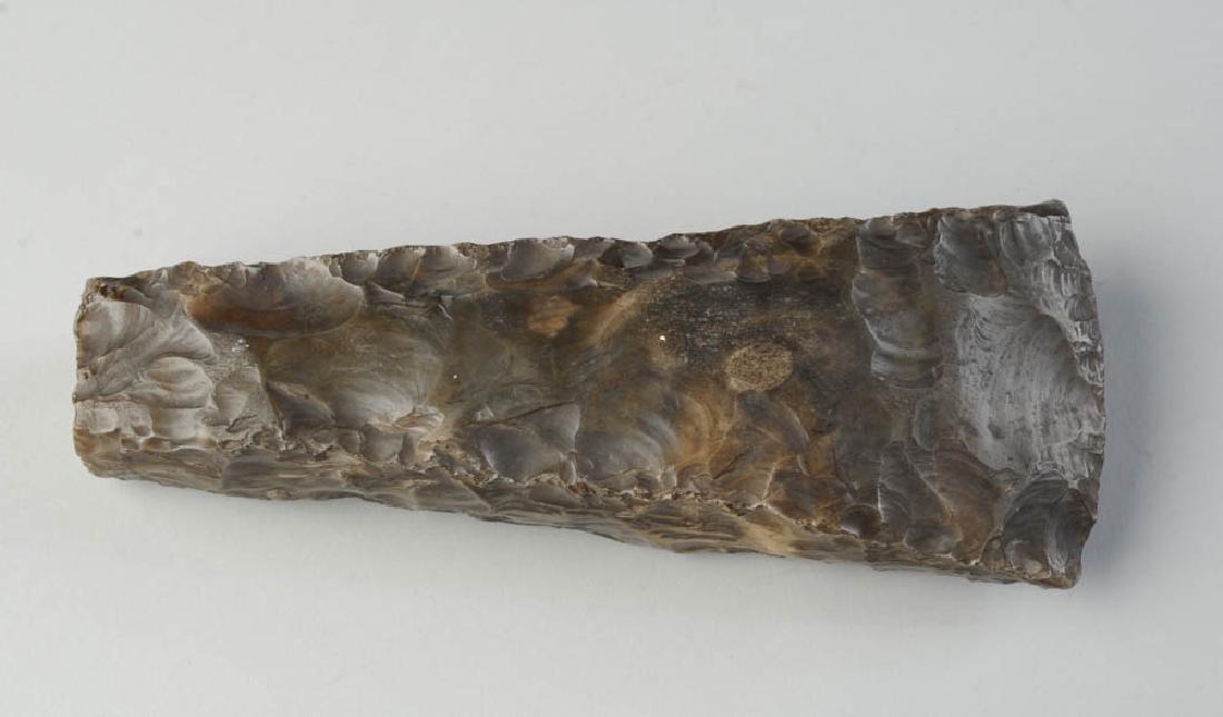 Polished Flint Axe Head: Age unknown. Approx. 7 3/4" x 3" x 1 1/4". Provenance: The collection of Ambassador and Mrs. Alexander Weddell of Virginia House Museum, Richmond, Virginia.