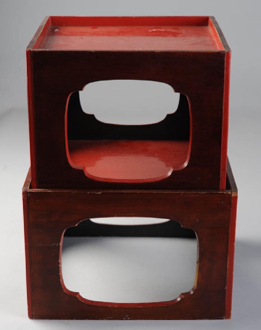 Two Asian Red Lacquer Stands or Small Tables: Wooden tables in square forms with quatrefoil side cut-outs, red lacquer tops, sides with reddish stain and red lacquer, interiors black. Some losses to lacquer, surface wear. Larger, approx. 12" x 12