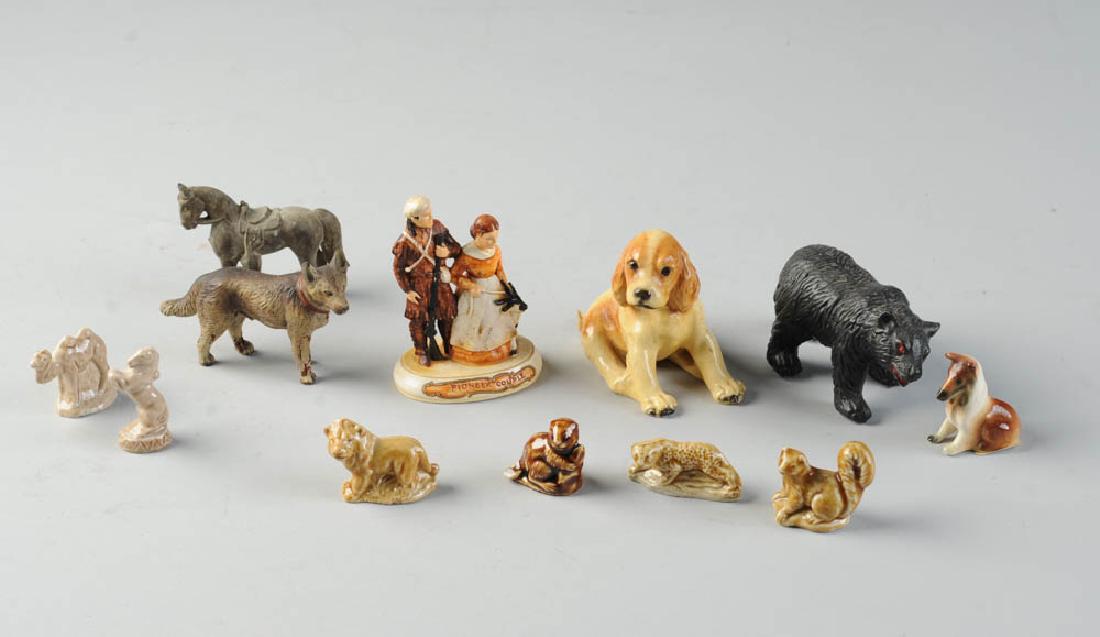 Lot Vintage Miniature Figurines, Animals & other: Eleven pieces total, porcelain, metal (lead?) and composition, German, English (Wade,) and a P. V. Baston 1958 Figure group "Pioneer Couple". Baston piece approx. 3 1/2" in height.