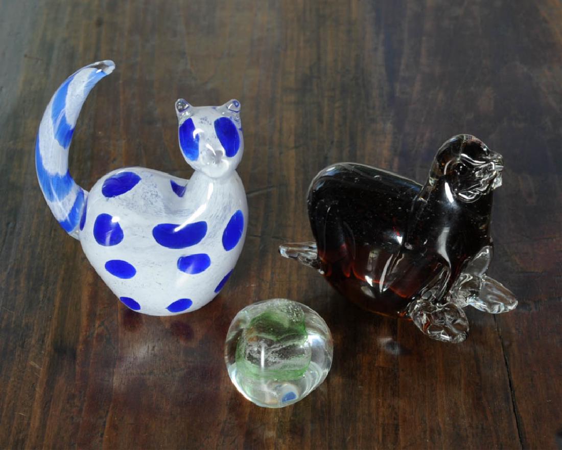 Figural Glass Lot: Including blue and white cat with raised tail, happy walrus, and an art glass paper weight. Tallest: approx. 5 1/4".