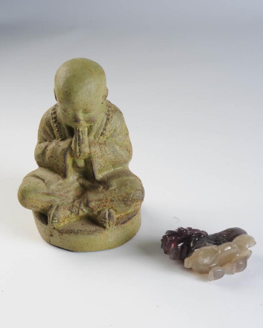 Asian Lot: Jade ? foo lion (damaged) and pottery ? seated Buddha. Tallest: approx. 9".