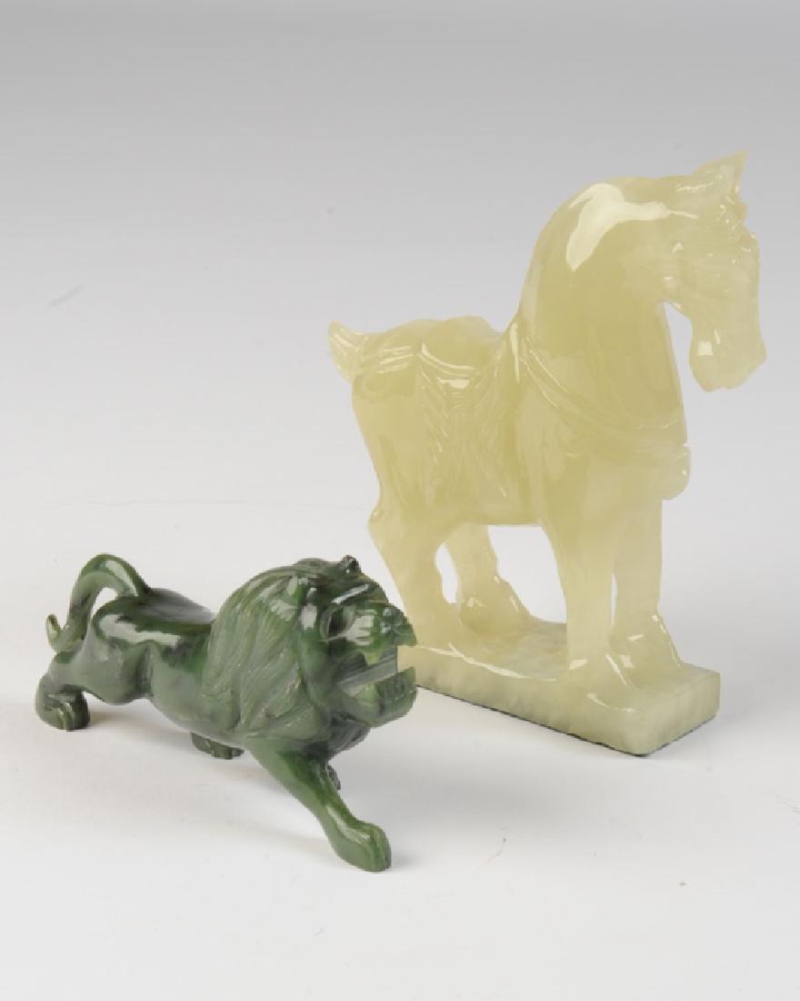 Two Carved Jade or Hardstone Figures: A spinach-green lion and a pale yellow-green horse. Horse, approx. 6" in height. Provenance: From the estate of Dr. Milton T. Edgerton (1921 - 2018.) A trailblazing plastic surgeon, Dr. Edgerton joine