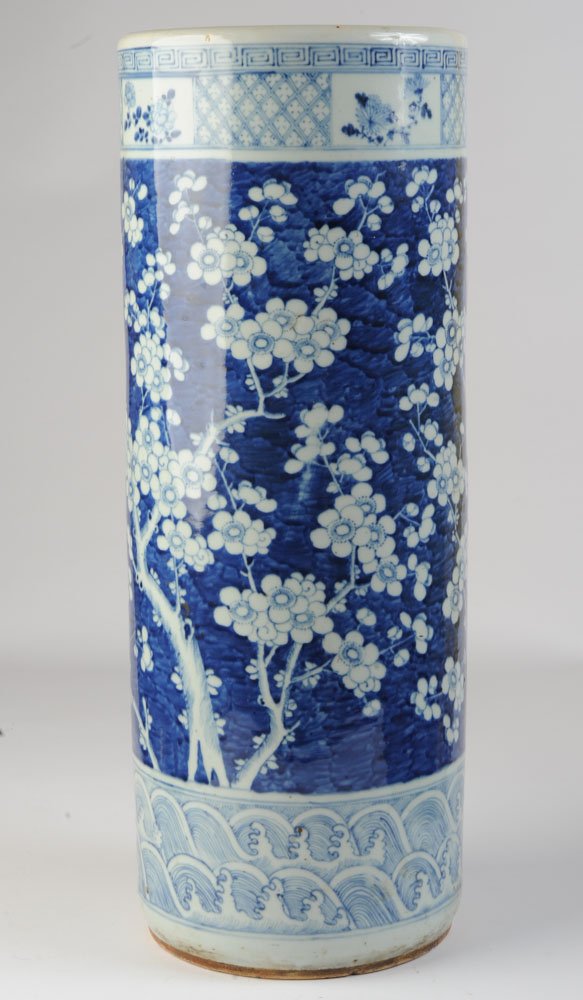 Chinese Blue & White Porcelain Umbrella Stand: Antique, probably 19th C., Chinese export umbrella stand with finely painted prunus design in underglaze blue, flanked by key border above wide band with diaper pattern interrupted by four rectangular