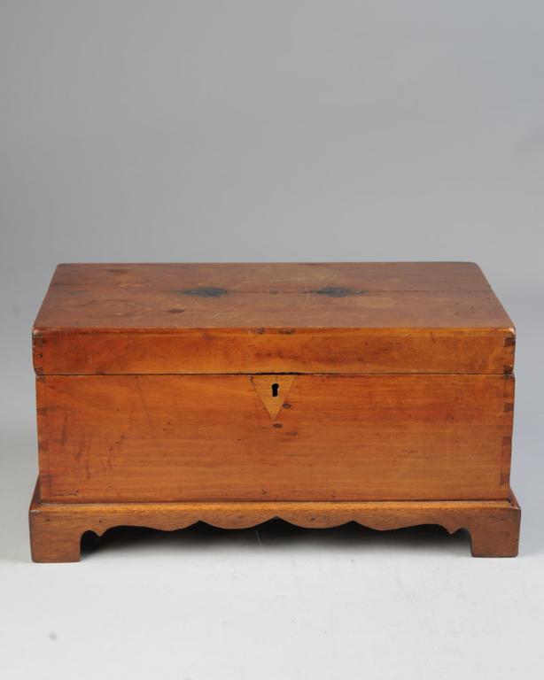 19th C. Miniature Blanket Chest: With dovetail construction, triangular inlaid wood lock plate, shaped apron and bracket feet. Approx. 16 3/4" L x 9 3/4" W x 8" H.