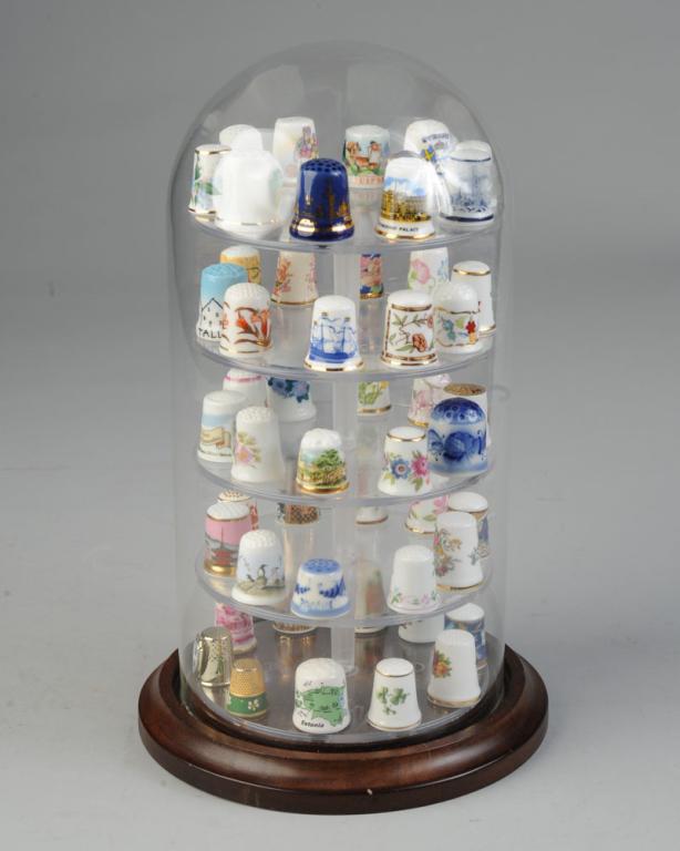 Large Lot of Thimbles: Mostly porcelain, various decorations and motifs including Estonia, Stockholm, Longton Hall (England), Buckingham Palace, Monticello, etc. Makers including Hutschenreuther, Royal Doulton, Minton, etc.