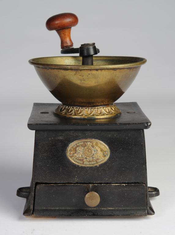 Antique English Kenrick & Sons Coffee Grinder: Cast iron and brass with wooden handle. Total H to top of handle: approx. 8 1/4".