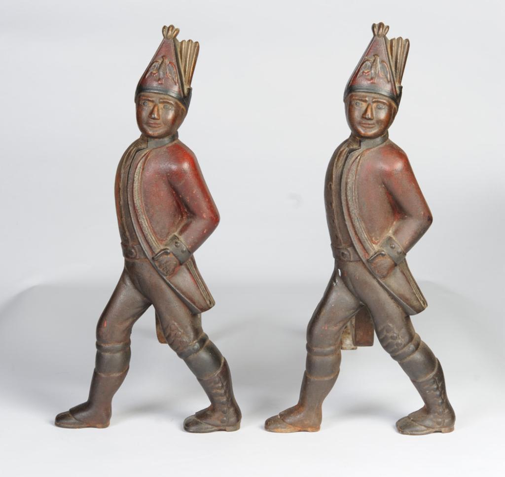 Pair Cast Iron Painted Prussian Soldier Andirons: Age unknown. H: approx. 19 7/8". Provenance: From the descendants of Jonathan Winship III (Massachusetts, 1780 â€“ 1843.) A sailor and business man, Winship and his brothers are credited with mak