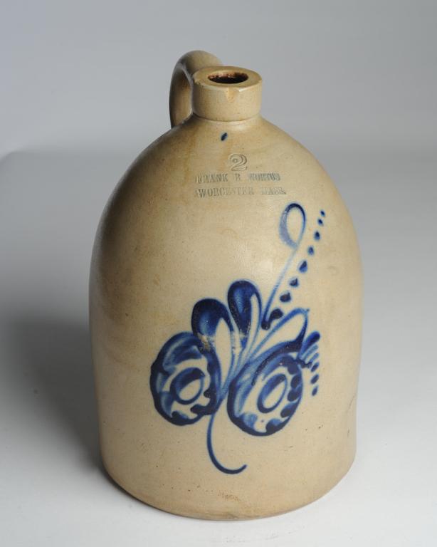 19th C. Frank B. Norton Worcester Mass Stoneware: 2-Gallon stoneware jug by Frank B. Norton of Worcester , Massachusetts, with cobalt blue floral decoration, stamped, minor rim chips. H: approx. 13 1/2". Provenance: From the descendants of Jonathan W