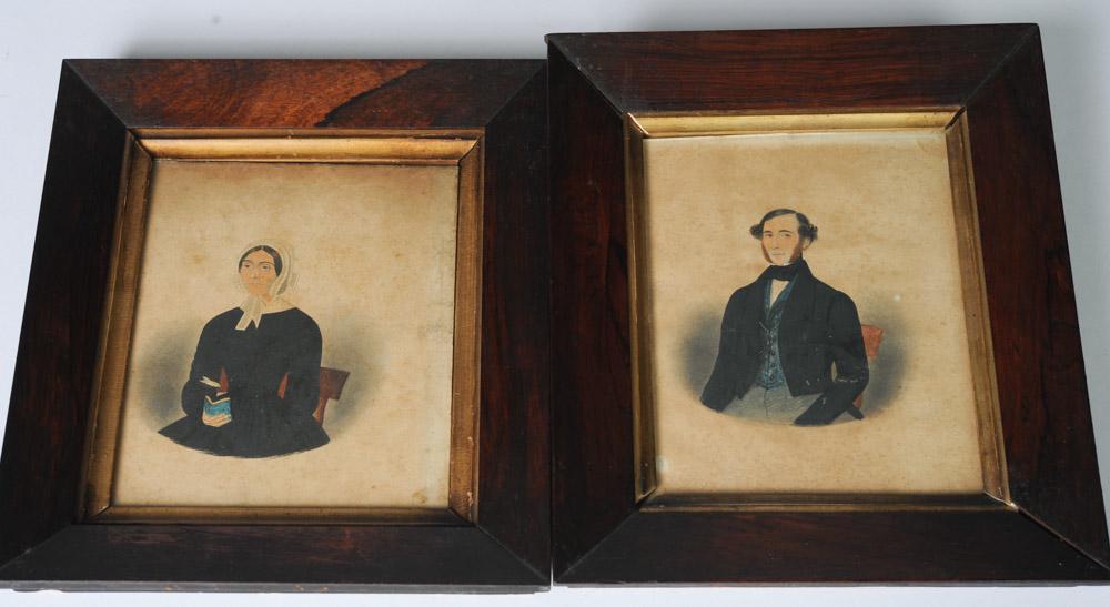 Pair 1846 Watercolor Folk Portraits, Identified: The lady, wearing a white bonnet and holding a bright blue book, is identified to verso as "Nancy Allanson, 1846, born 1785, died 1858, Mother of Thos. Allanson". The gentleman with black hair and red