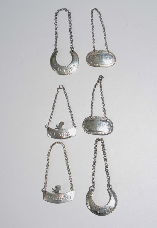 Six English Sterling Silver Bottle Collars: All marked, in as-found condition. Total weight: approx. 2.08 ozt.