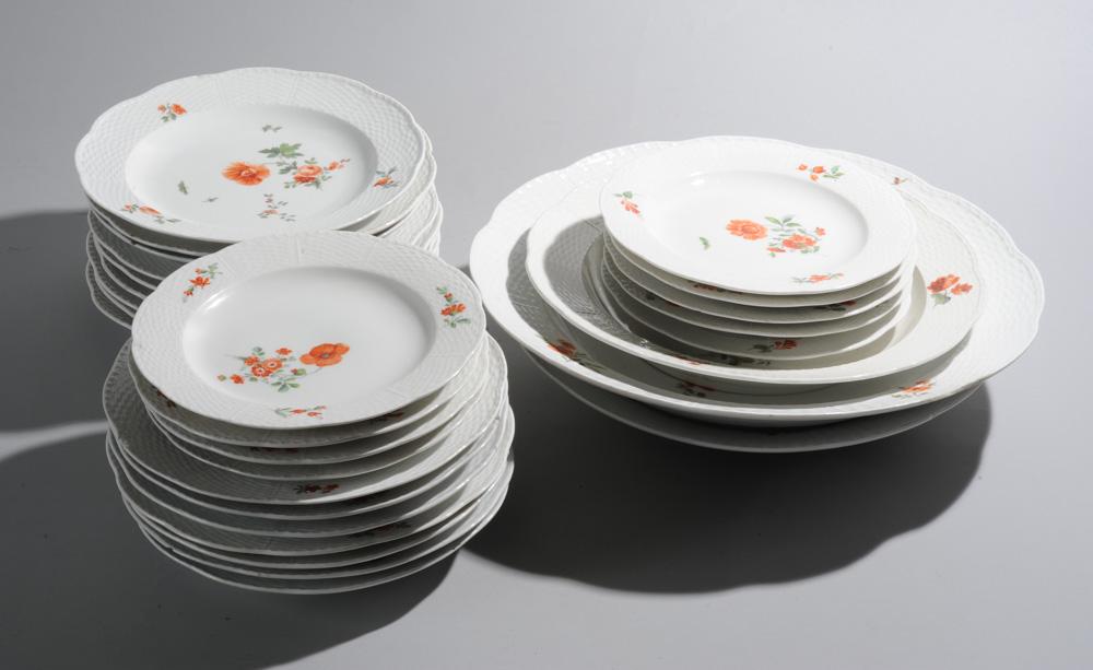 28 pcs. 19th C. Floral Decorated Porcelain Lot: 3 platters and 25 plates, marked in blue to undersides, possibly KPM, many show chips and cracks / in as-found condition. Largest platter dia: approx. 15".