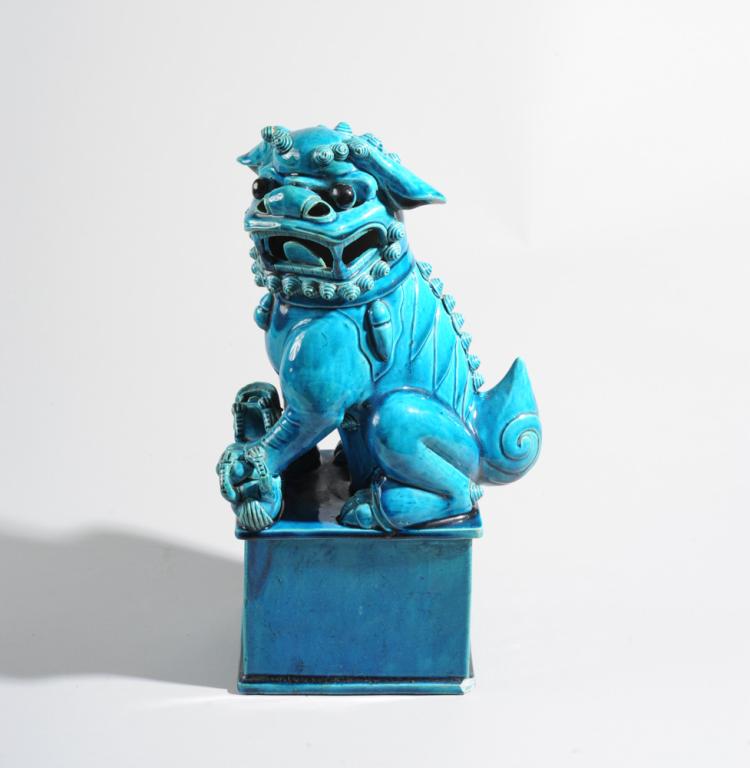 Chinese Turquoise Glaze Foo Dog: Chinese export porcelain seated foo dog / Buddhist lion and pup with brilliant turquoise glaze. Chip to one bottom corner, repair to one curl. Approx. 16 1/2" in height.