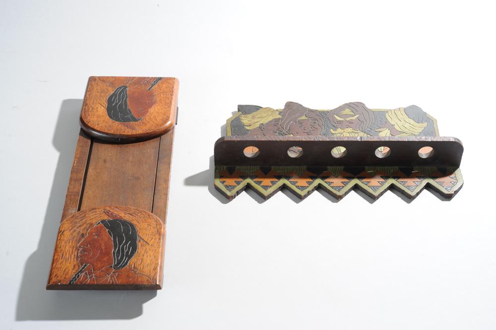 2 Arts & Crafts Period Items: Carved wooden pipe rack with incised and painted images of Middle Eastern gentlemen in turbans smoking pipes, offered together with pair of sliding wooden bookends with pyrography images of Native Ame