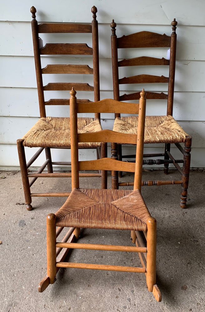 19th C. Chair & Rocker Lot: 2 Ladderback rush seat side chairs and 1 small rocker, each with carved finials.