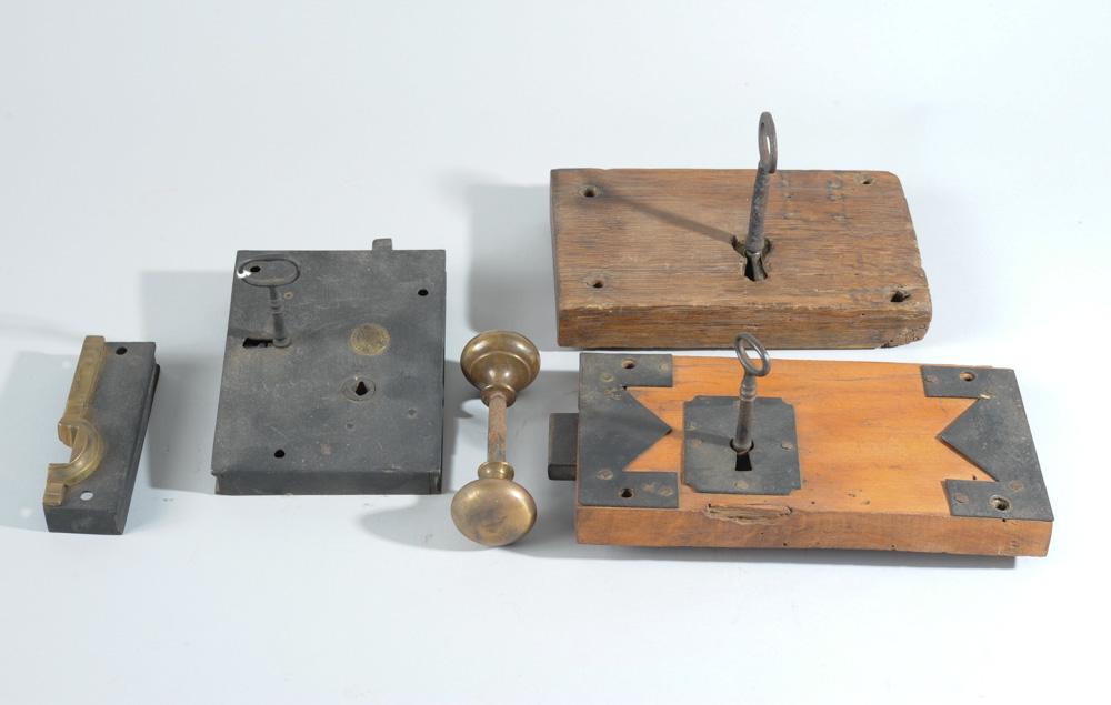 Three 19th C. Door Locks with Keys: One a 19th century carpenter lock with key strike and knobs, the other two are wooden. Largest: approx. 5" x 9".