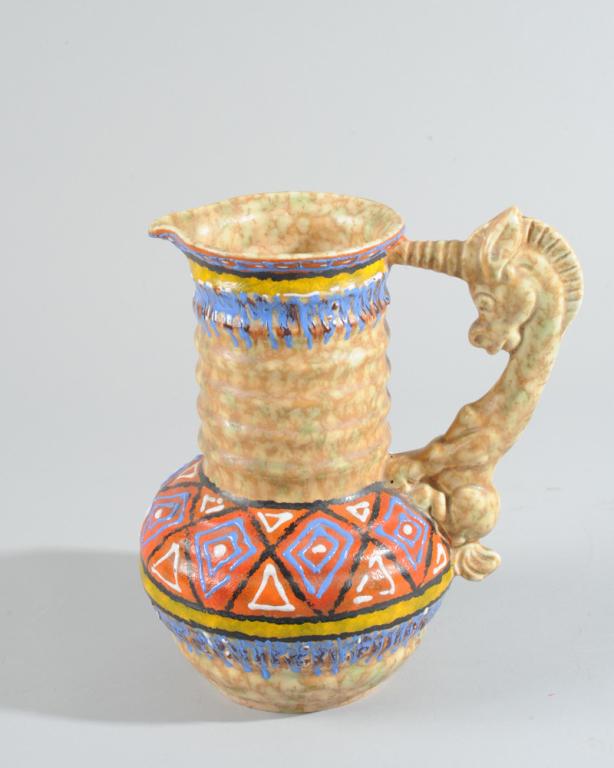 Czech Pitcher: A Unicorn handle, bratley colored, marked to base Made in Czeckoslovia. H: approx. 8".