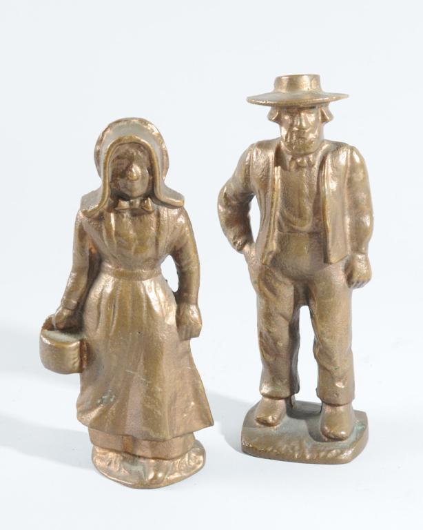 Pair Iron Amish Figure Doorstops: One man and one woman. H: approx. 8 3/4".