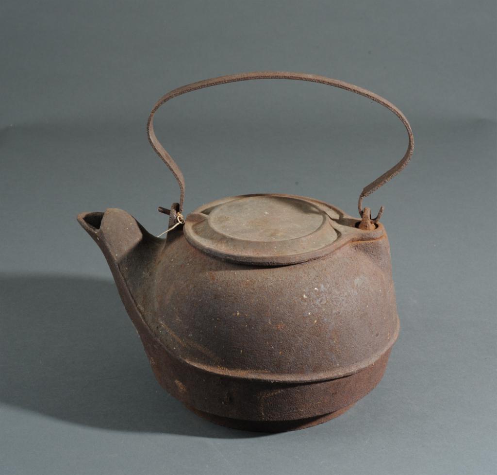 19th C. Cast Iron Tea Kettle: With original lid. H: approx. 11 1/2" handle up.