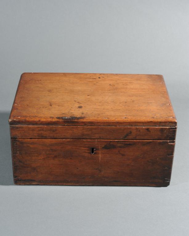 Early 19th C. Mahogany Lidded Box: With dovetailed construction, brass locking hardware (no key), in as-found condition. H: approx. 5 1/2". W: approx. 11". D: approx. 7 3/4".