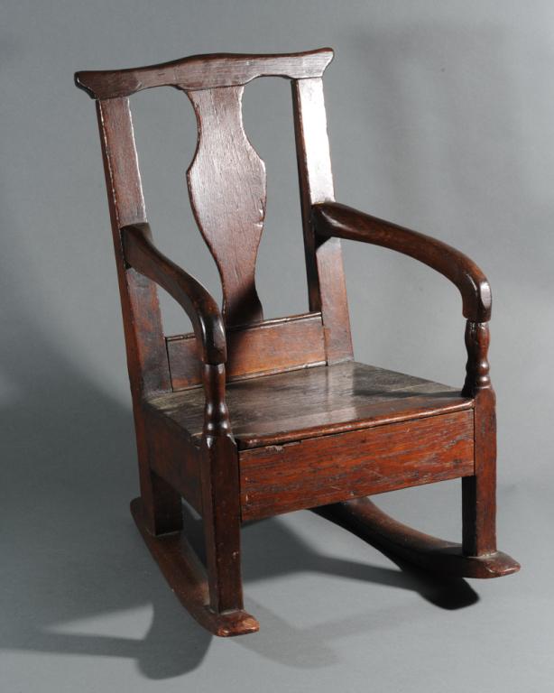 Antique Welsh Child's Rocking Chair: Circa 1780 - 1810, Oak, with vasiform splat, turned armrest supports, in as-found condition. H: approx. 20".
