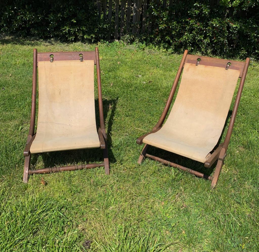 Pair British or French Colonial Campaign Chairs: Folding chairs, wood and original heavy canvas with brass hardware. Approx.