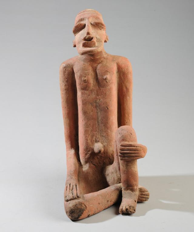 Djenne Terracotta Male Figure: Seated terracotta pottery Djenne type figure, Mali. We cannot verify the age of this figure. Repairs. Approx. 15" in height. Provenance: Estate of Thomas McNemar, (1931-2019.) McNemar lived and collec